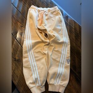 Men’s Peloton Adidas jogger sweatpants light yellow/orange color. Size M